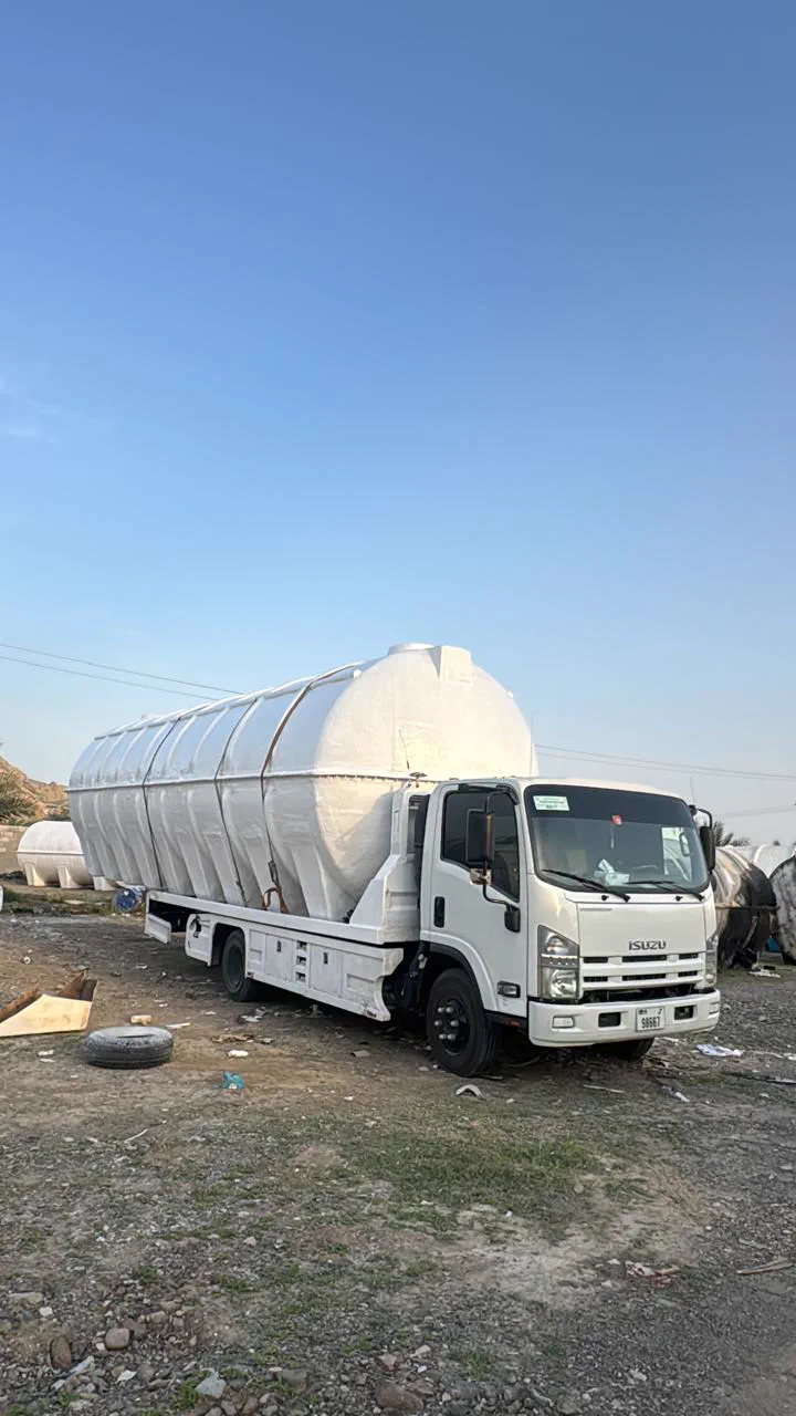 Storage tank loaded on a delivery truck