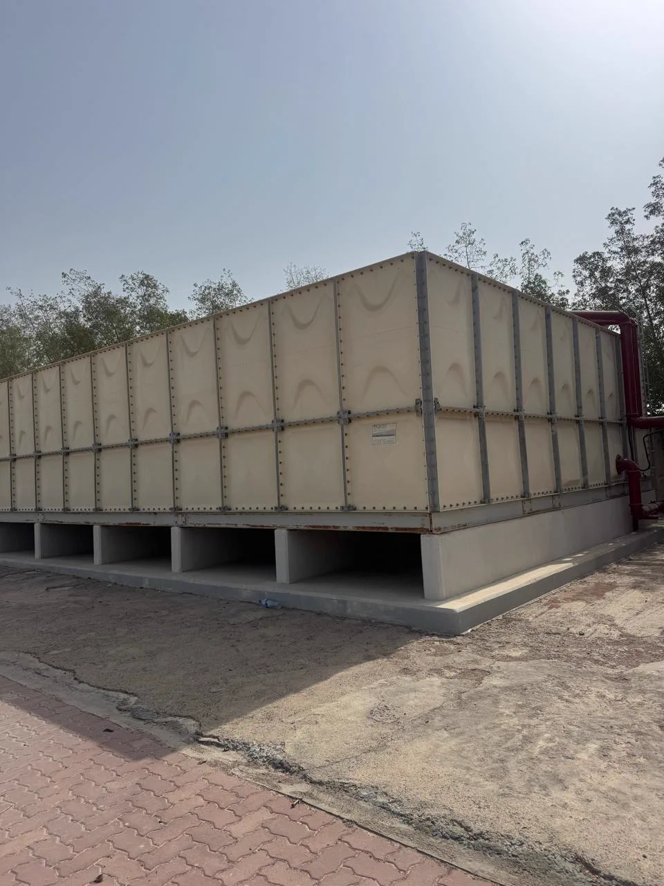 Large sectional GRP panel tank assembled on site