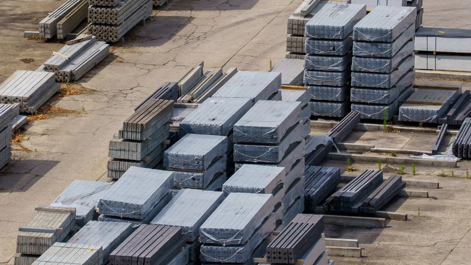 Civil works and site fixings — precast units stacked in the yard