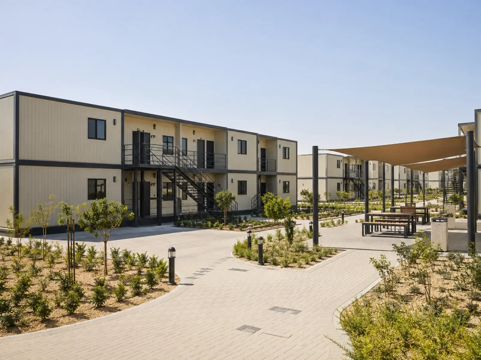 A modular labour accommodation complex with shaded courtyard and external stair access