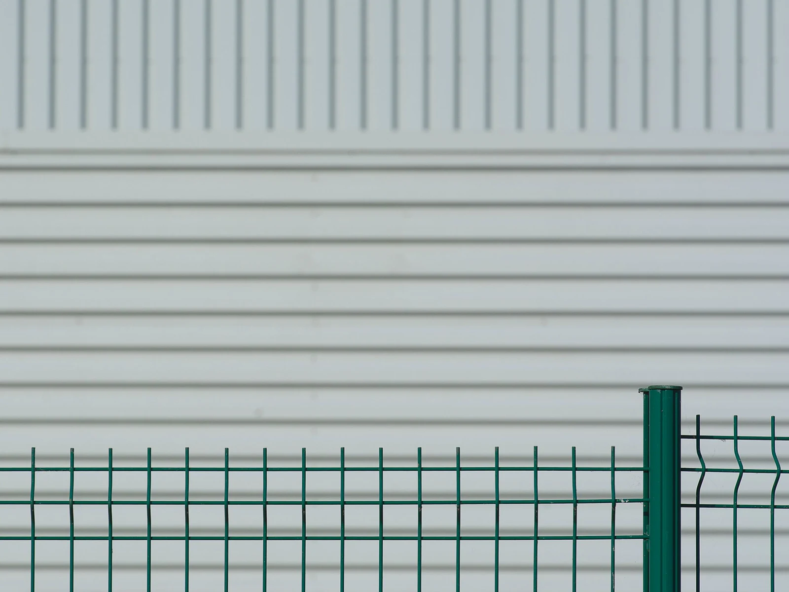 A V-bend mesh panel bolted to its post